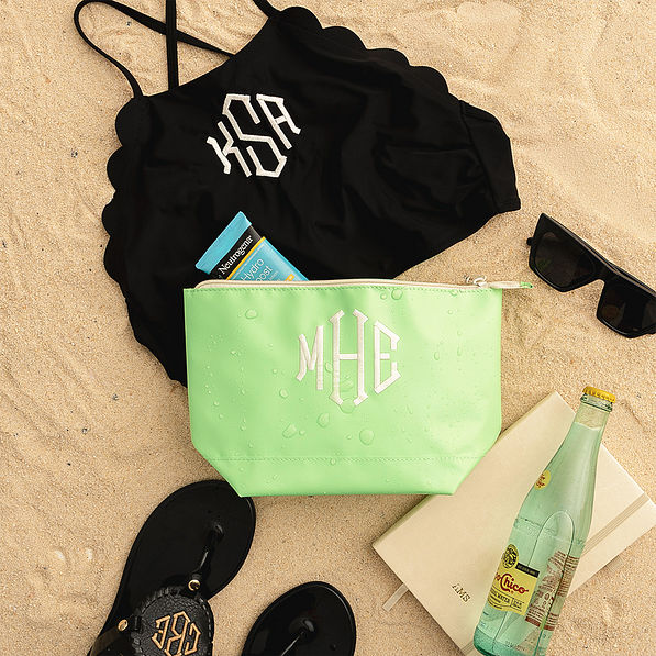 lime monogrammed cosmetic pouch flatlay