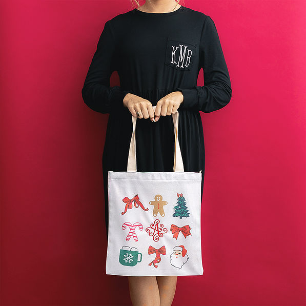 girl holding christmas bag front