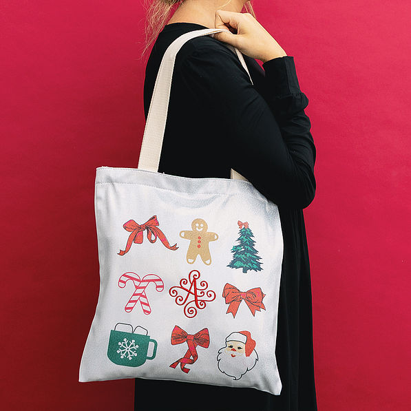 girl holding christmas bag side