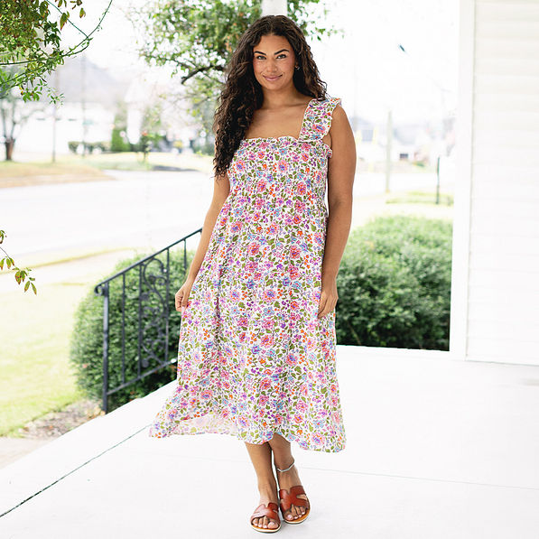 girl wearing smocked dress in flora trellis