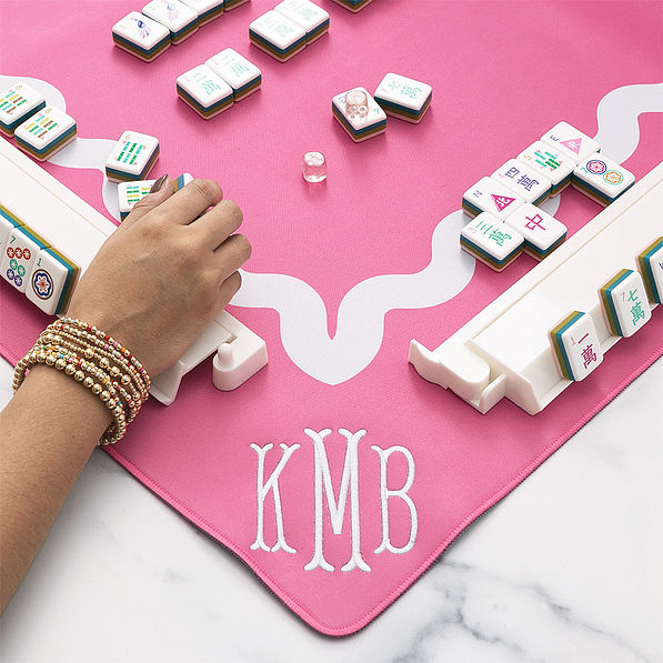 girl playing mahjong on mahjong mat