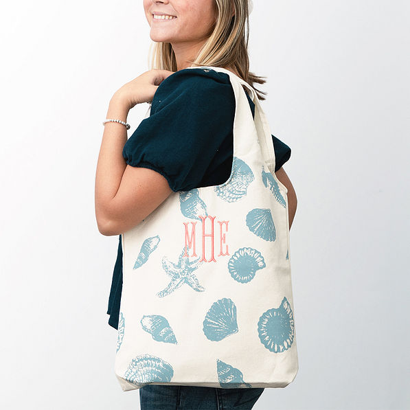 light blue shells hobo bag on shoulder