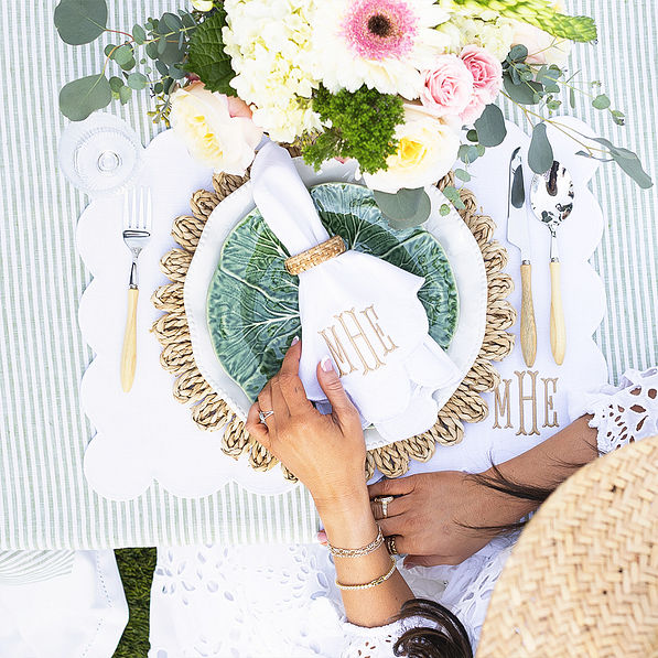 white scalloped napkin table setting