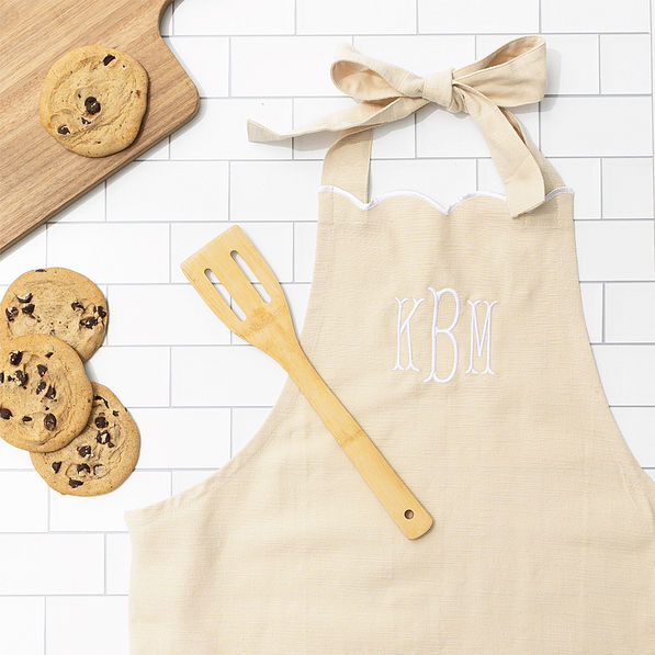 khaki scalloped apron flatlay