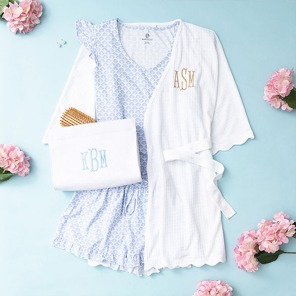 white terry toiletry bag with ruffle pajamas and scalloped robe