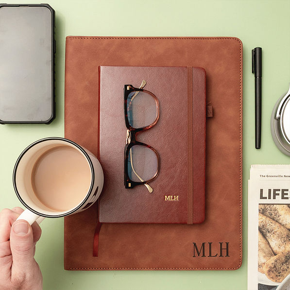 brown notebook on green background