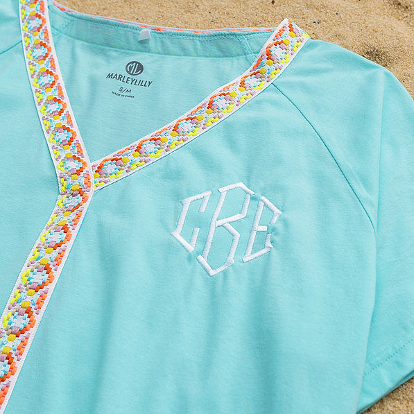close up of monogrammed accent cover up in ocean