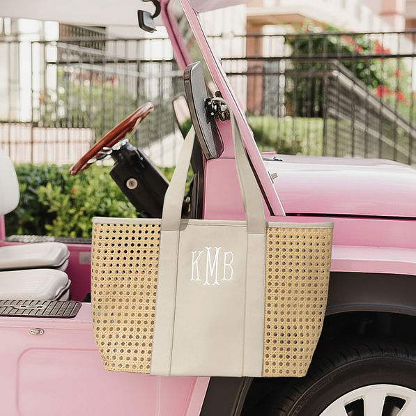 personalized caning tote bag on pink car at beach