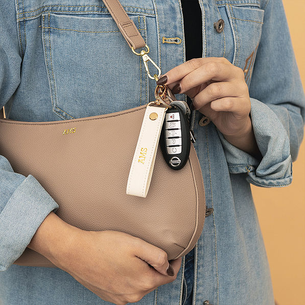 ivory classic keychain on purse