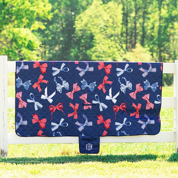 patriotic bows picnic blanket hanging on fence