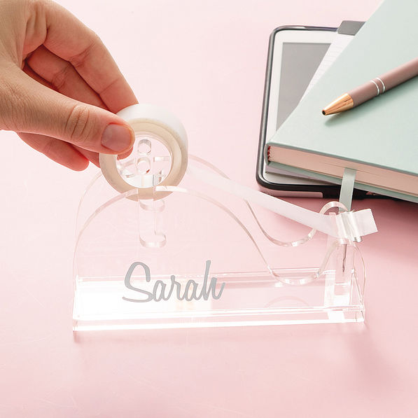 tape going into monogrammed tape dispenser