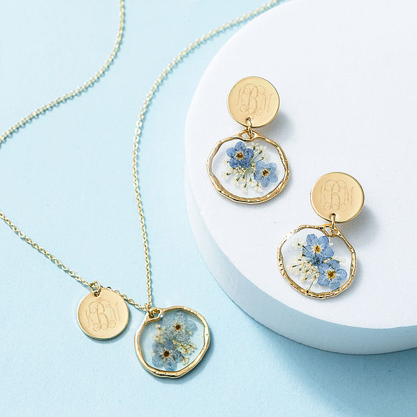 Forget me not earrings and necklace on blue