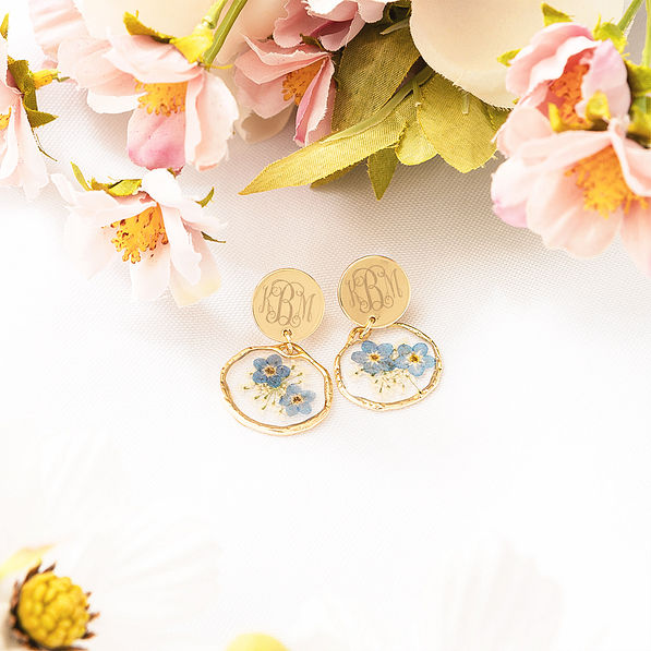 Forget me not earrings with flowers flatlay