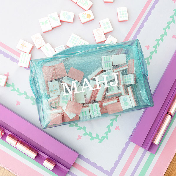 clear blue monogrammed mahjong tile bag on mahjong board