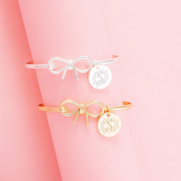 gold and silver bangles on pink