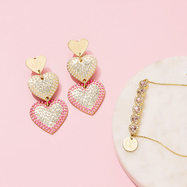 monogrammed rhinestone heart bracelet and earrings on pink