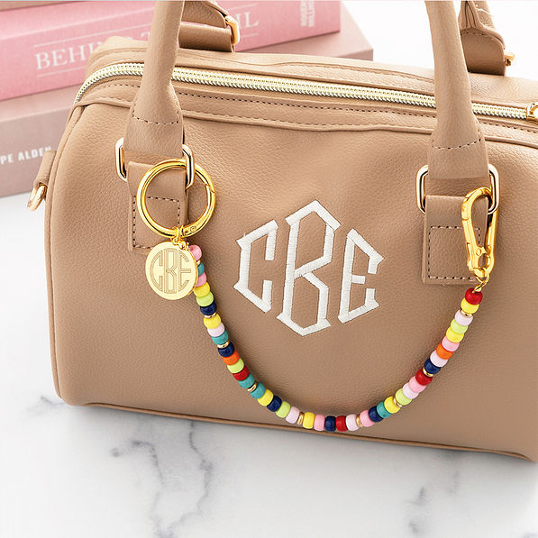 multi bag charm keychain across small bag