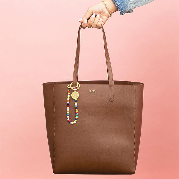 multi bag charm keychain on leather bag