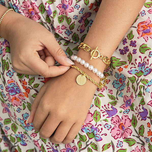 girl wearing personalized twisted rope bracelet in gold