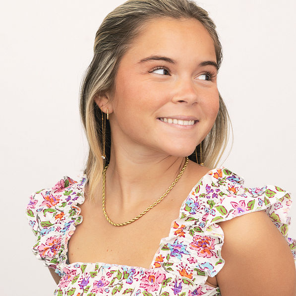 girl wearing twisted rope necklace in gold