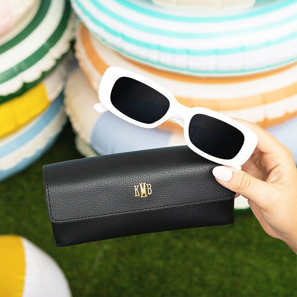black sunglasses case with white sunglasses