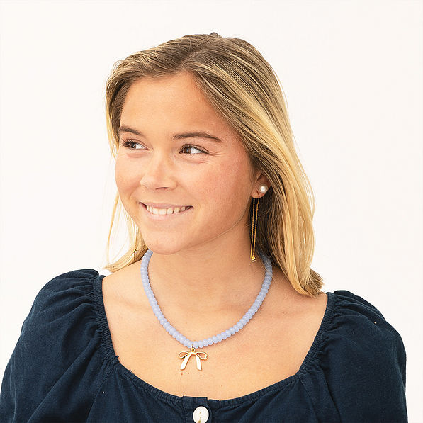 Beaded bow necklace on girl