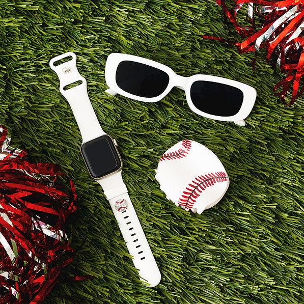 baseball hair clip on grass with apple watch band