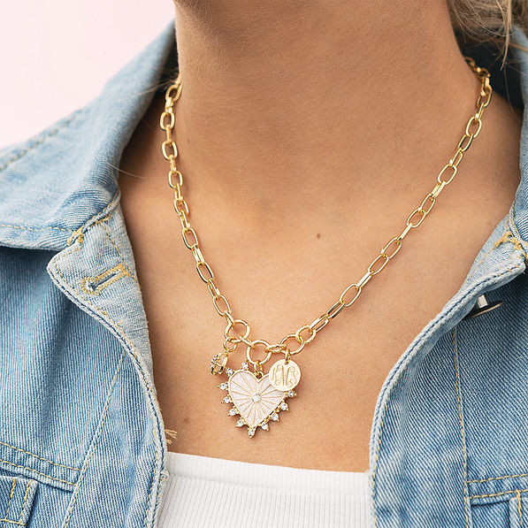 Girl wearing charm heart necklace