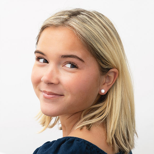 girl wearing 8mm pearl earrings