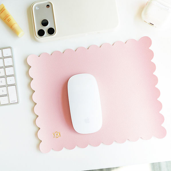 pink scalloped mouse pad on office desk