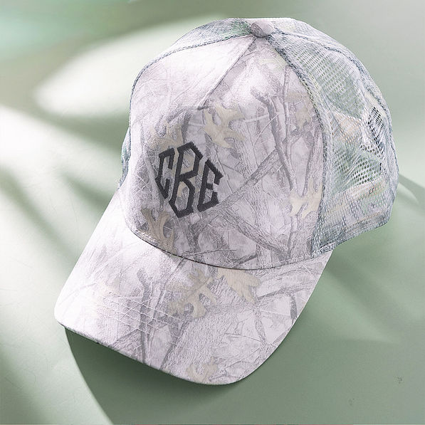 camo trucker hat on green