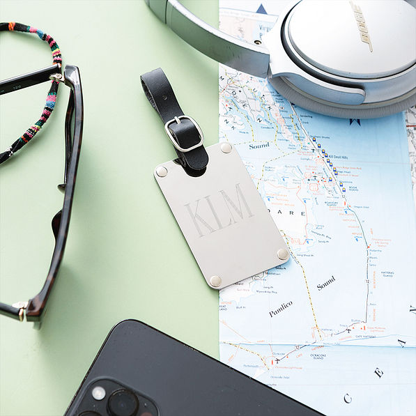silver stainless steel luggage tag with map