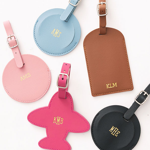 multiple monogrammed luggage tags up close