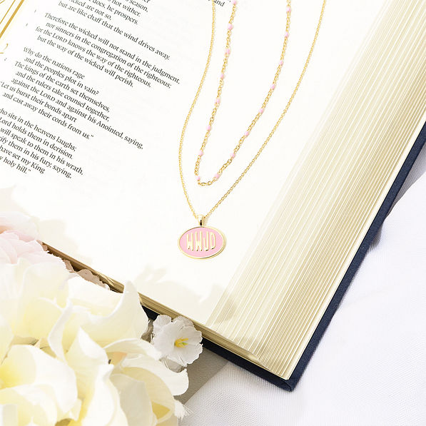 pink wwjd necklace on bible