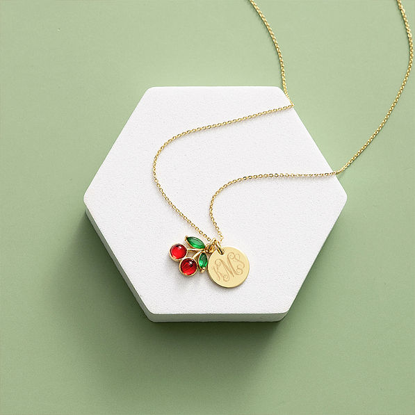 cherry necklace on green