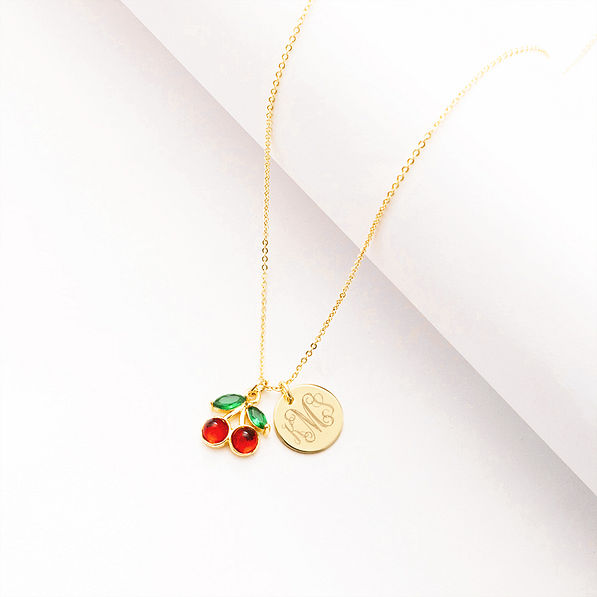 cherry necklace on white roll