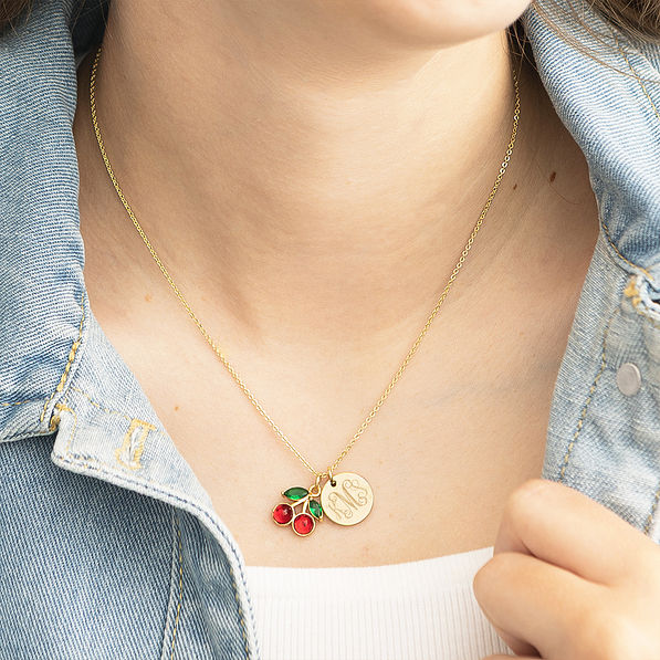 girl wearing monogrammed cherry necklace