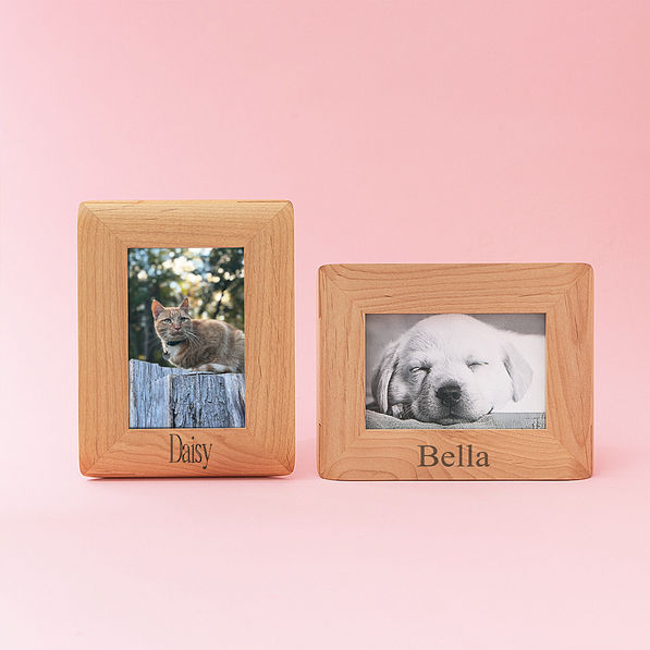 two personalized pet photo frames on pink