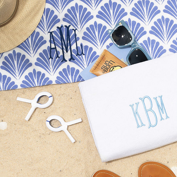 White beach chair towel clips with blue shells towel