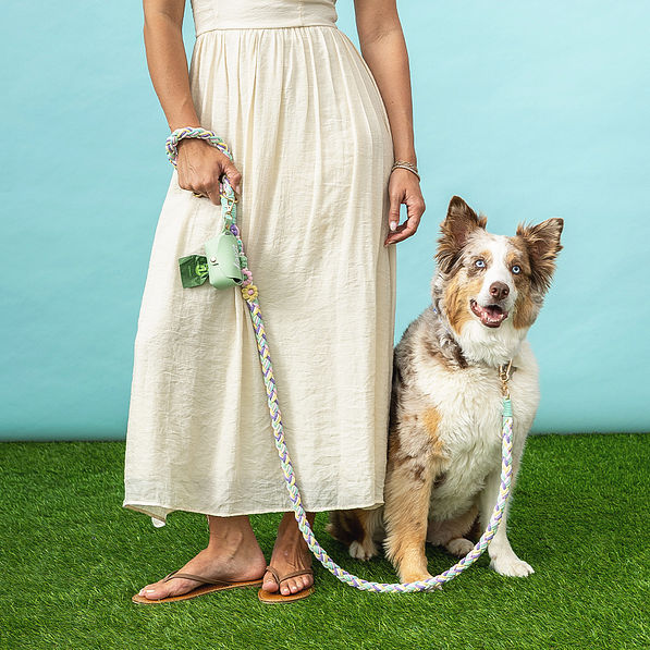 girl and dog on leash with pet waste bag holder embroidery