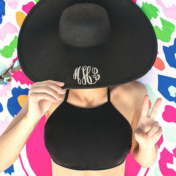 monogrammed black derby hat with multi leopard towel