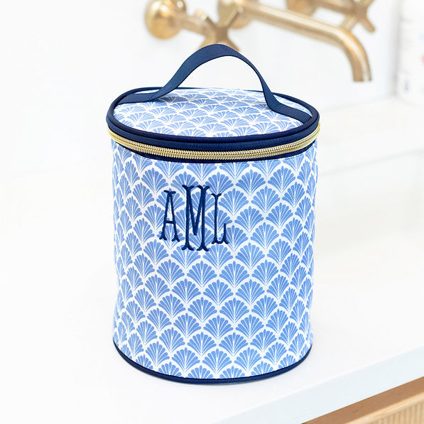 monogrammed blue shells ditty bag on bathroom counter