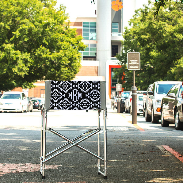 aztec patterned monogrammed tailgate chair at football stadium