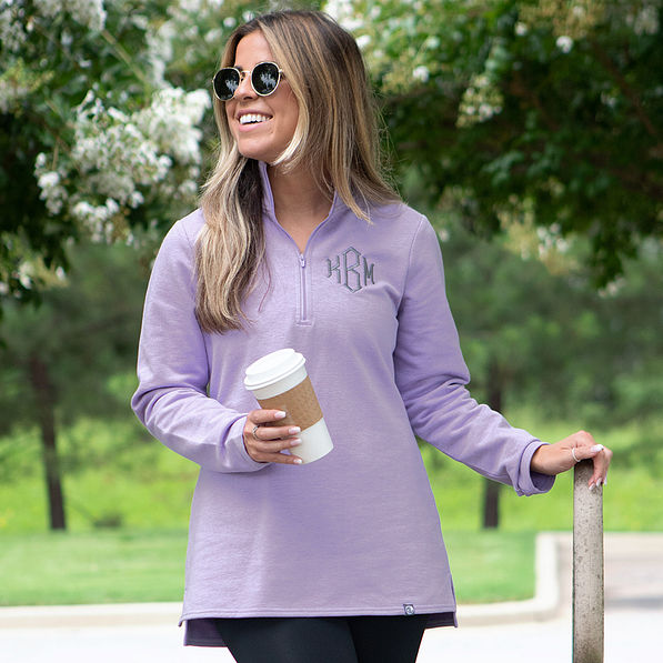 lavender pullover worn with leggings in the fall