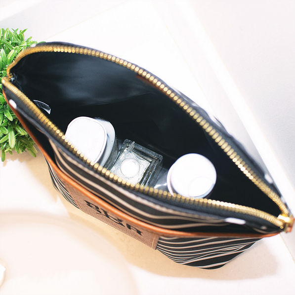 inside monogrammed shampoo bag with bottles