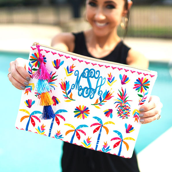 white cabana clutch with black romper