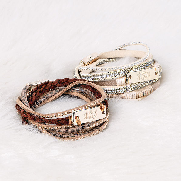 monogrammed wrap bracelet stacks on fur rug