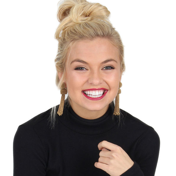 Model wearing gold beaded Tassel Earrings