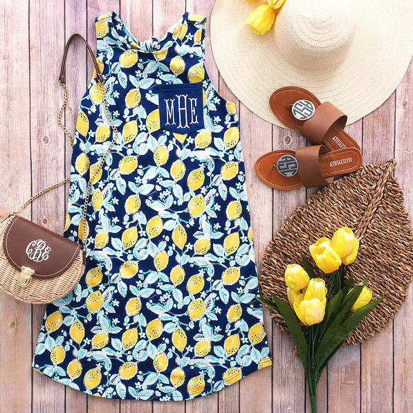 monogrammed lemon swing dress with wicker purse and sandals