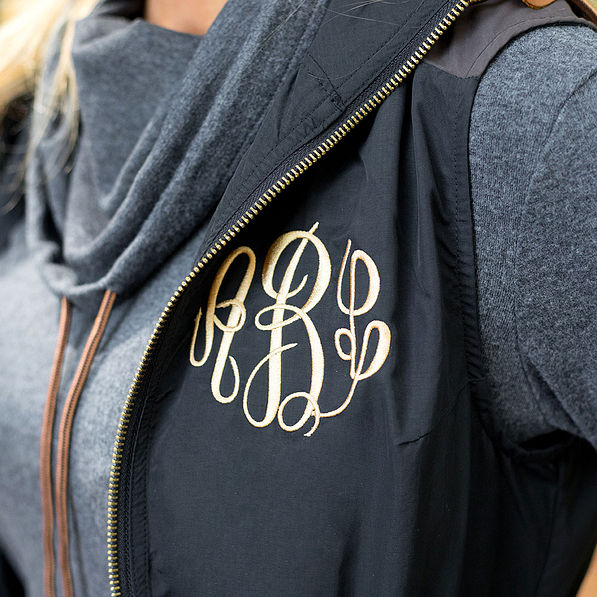 close up of monogrammed utility vest